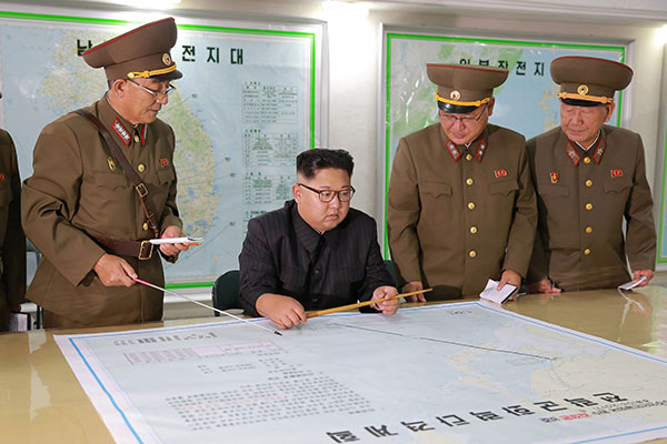 Ẩn ý sau quyết định dừng kế hoạch tấn công đảo Guam của Kim Jong-un?